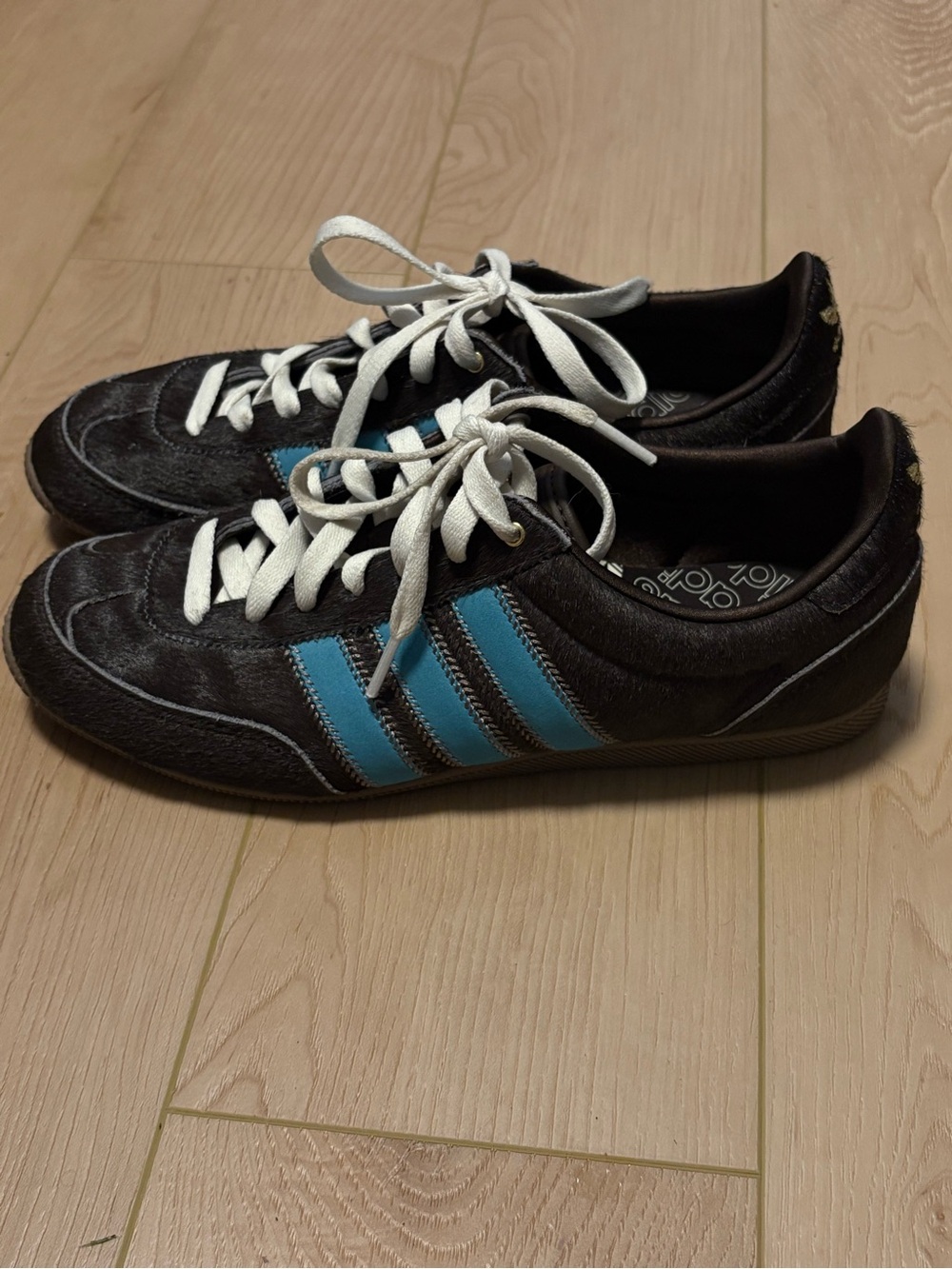Adidas women’s  Sneakers with Blue Stripes